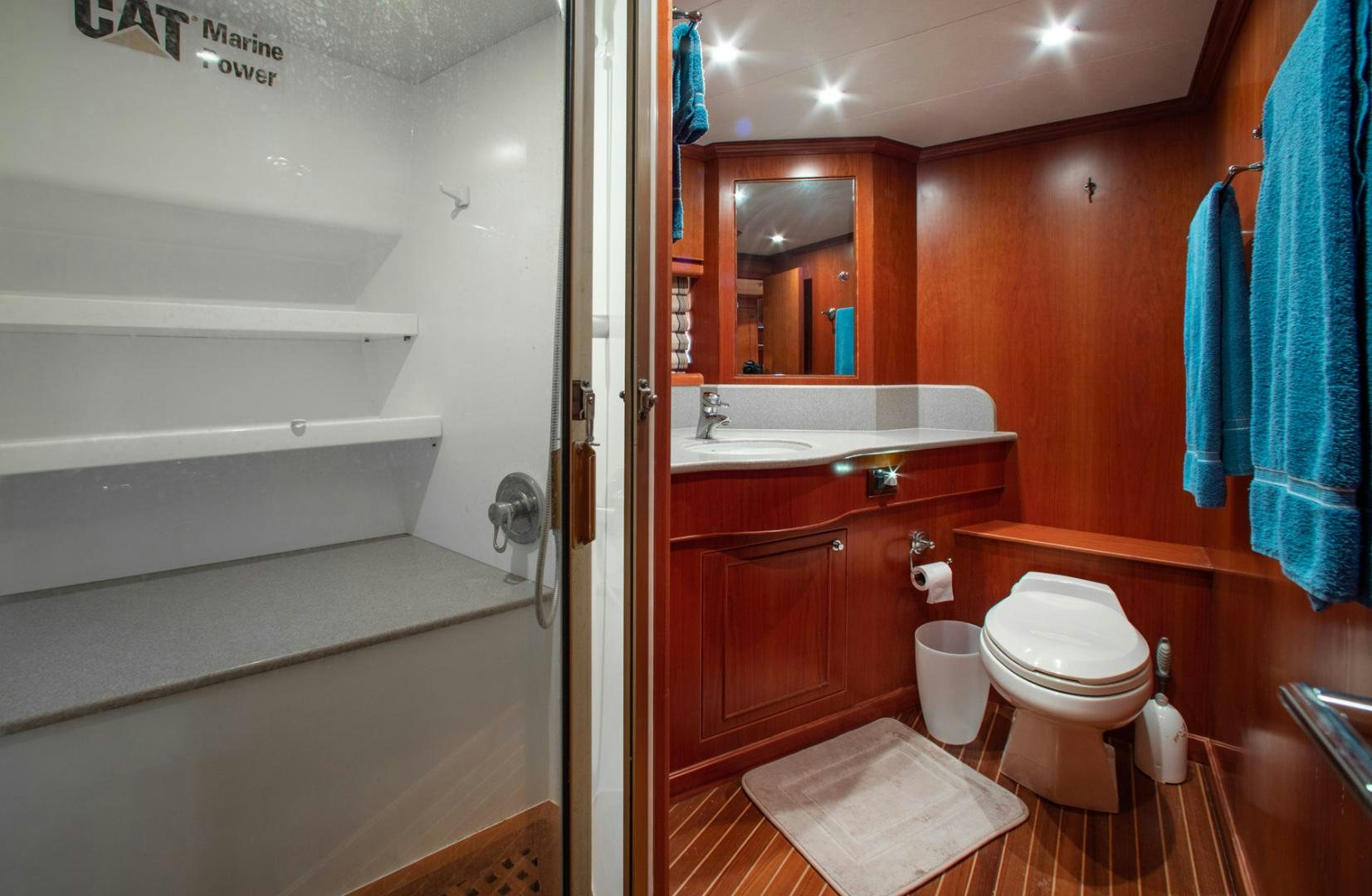 a bathroom with a toilet and a sink aboard BOXES II Yacht for Sale
