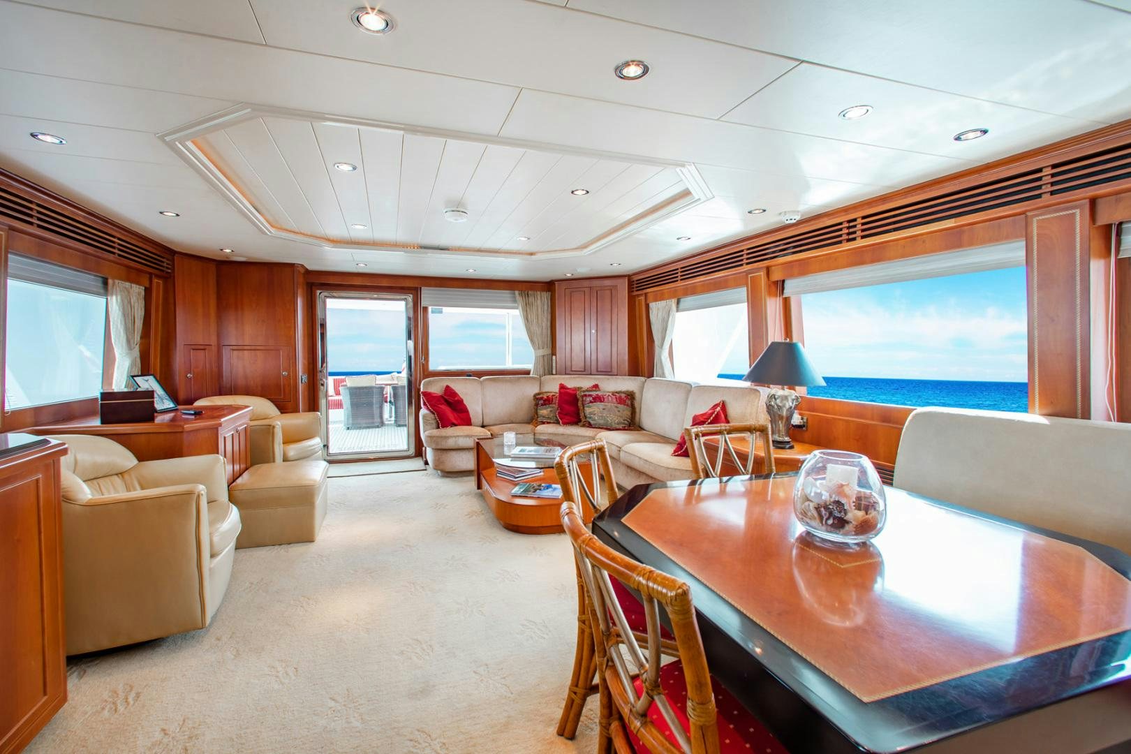 a living room with a table and chairs aboard BOXES II Yacht for Sale