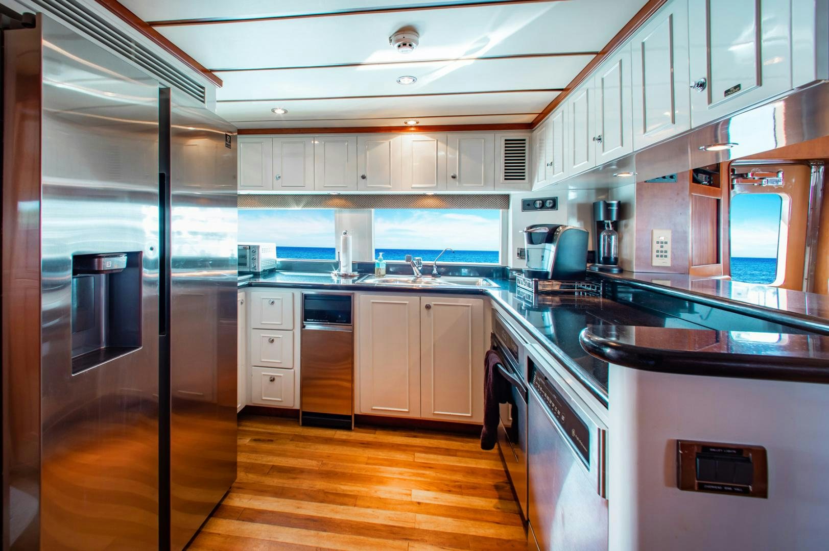 a large kitchen with stainless steel appliances aboard BOXES II Yacht for Sale