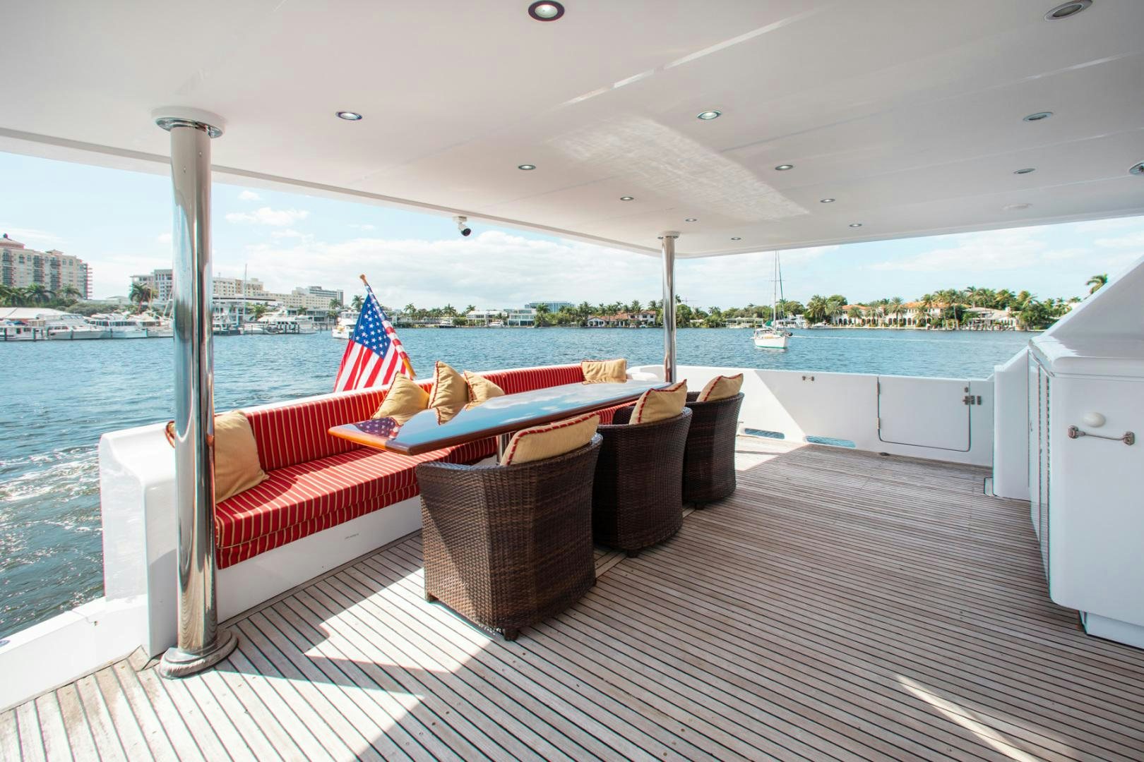 a deck with a couch and a chair on it aboard BOXES II Yacht for Sale