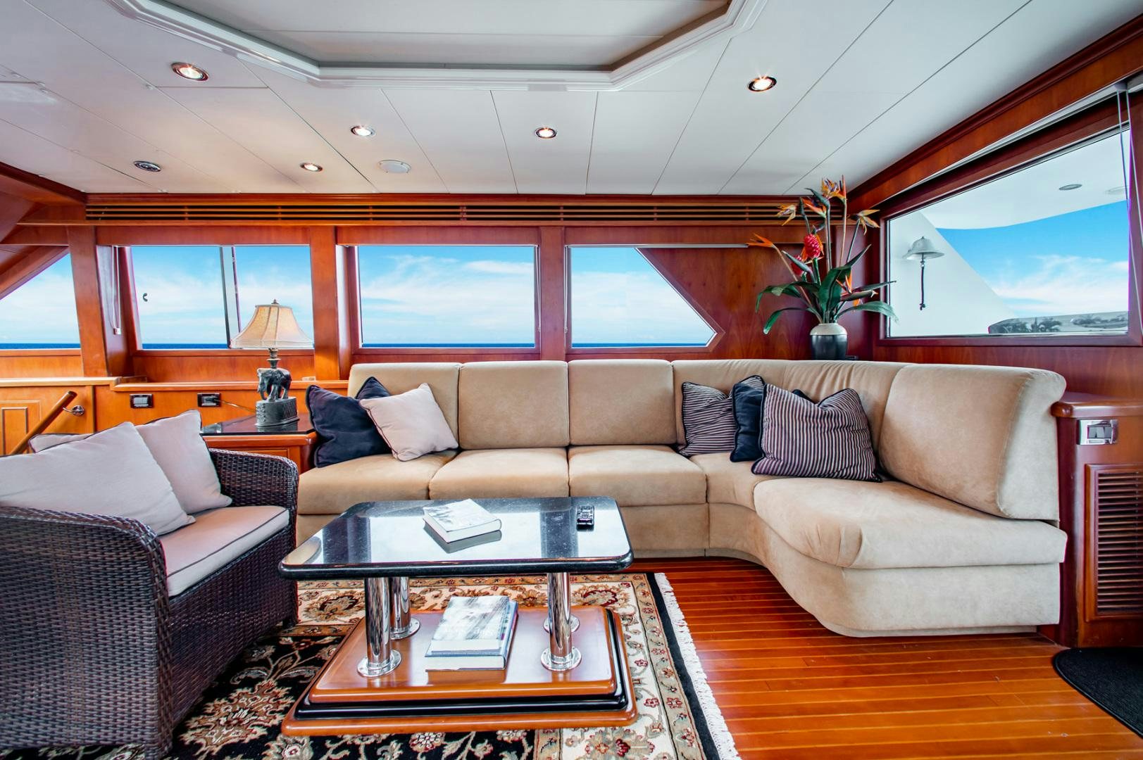 a living room with a couch and a coffee table aboard BOXES II Yacht for Sale