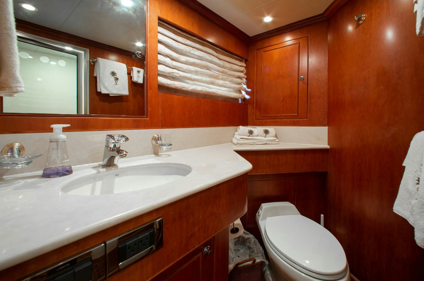 a bathroom with a sink and toilet aboard BOXES II Yacht for Sale