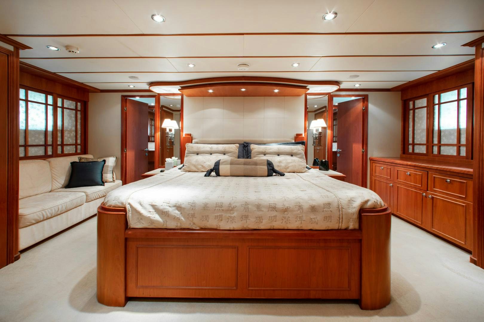 a room with a bed and a couch aboard BOXES II Yacht for Sale
