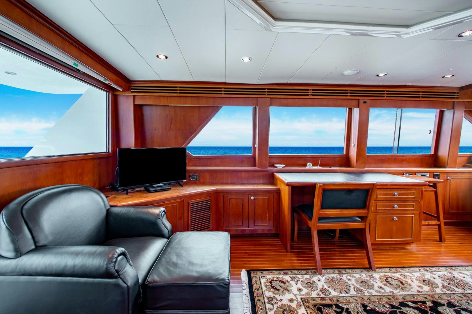 a room with a couch and a tv aboard BOXES II Yacht for Sale
