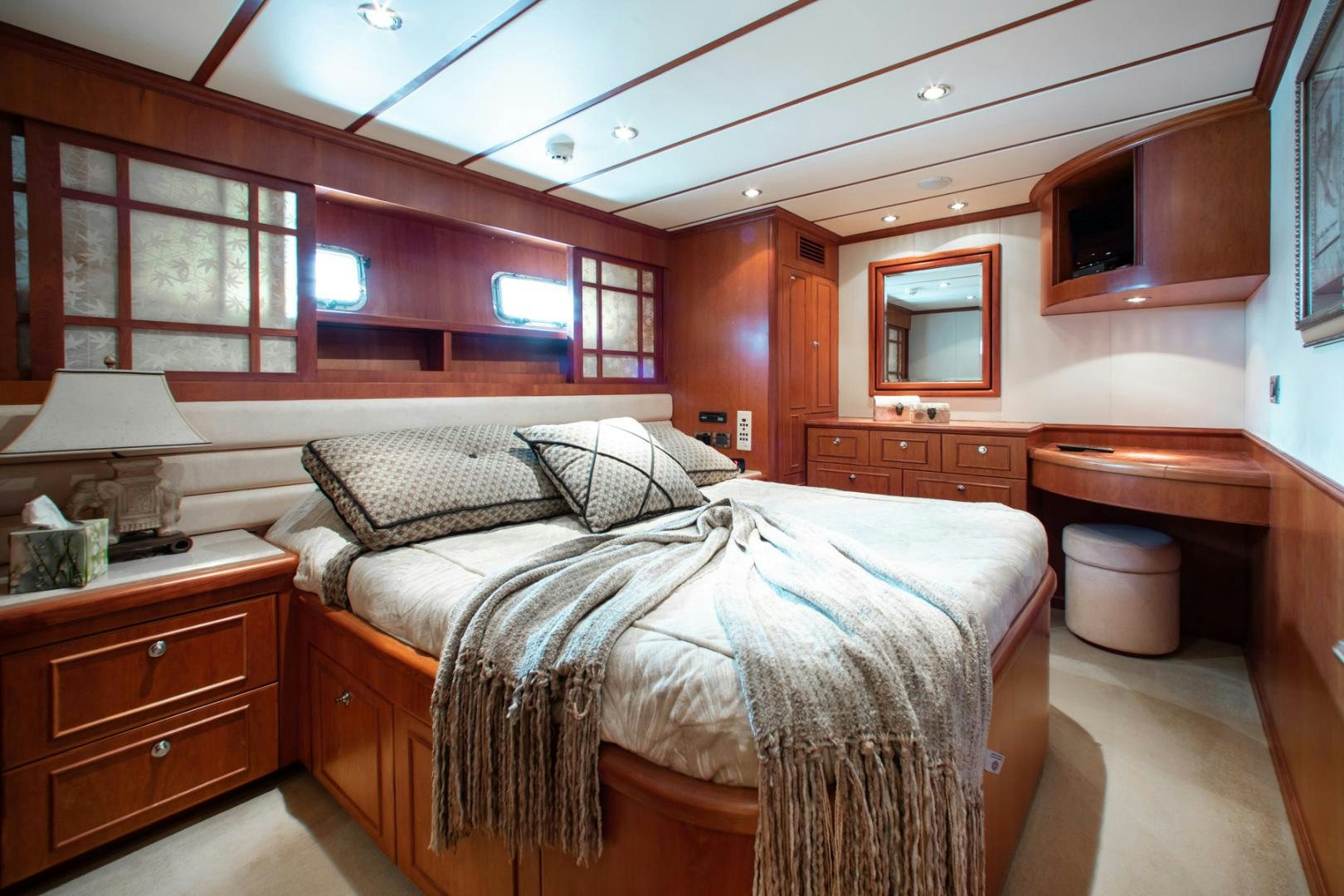 a bedroom with a bed and a desk aboard BOXES II Yacht for Sale