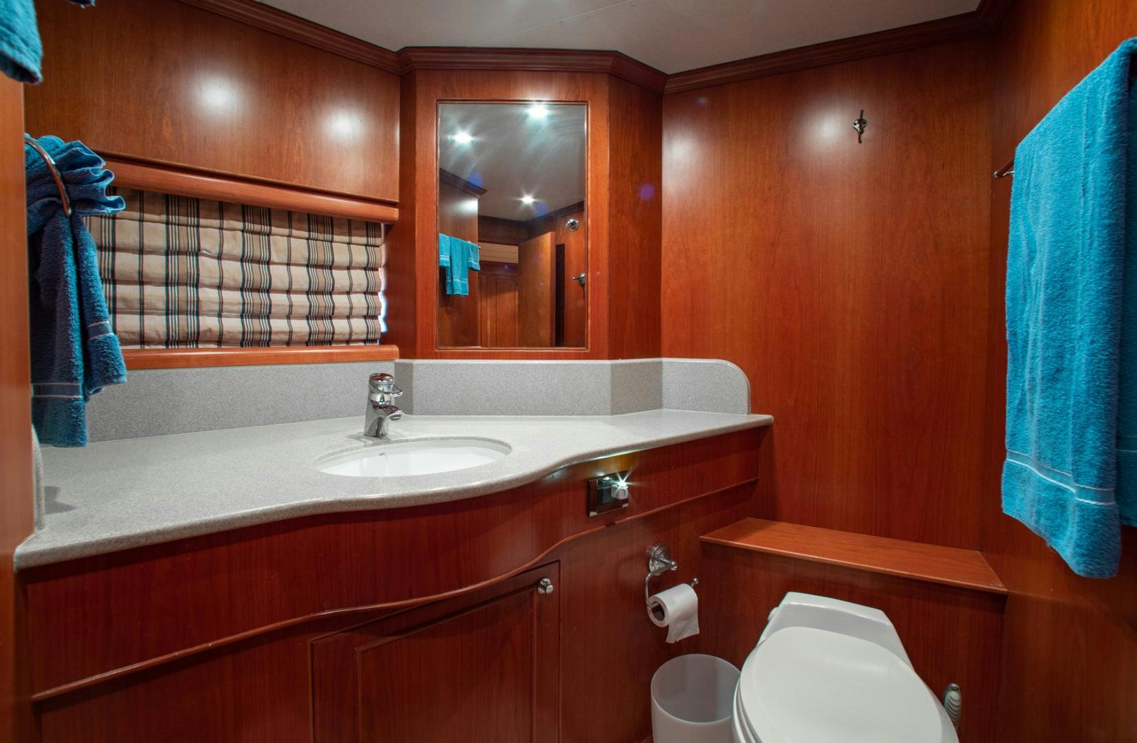 a bathroom with a sink and a mirror aboard BOXES II Yacht for Sale