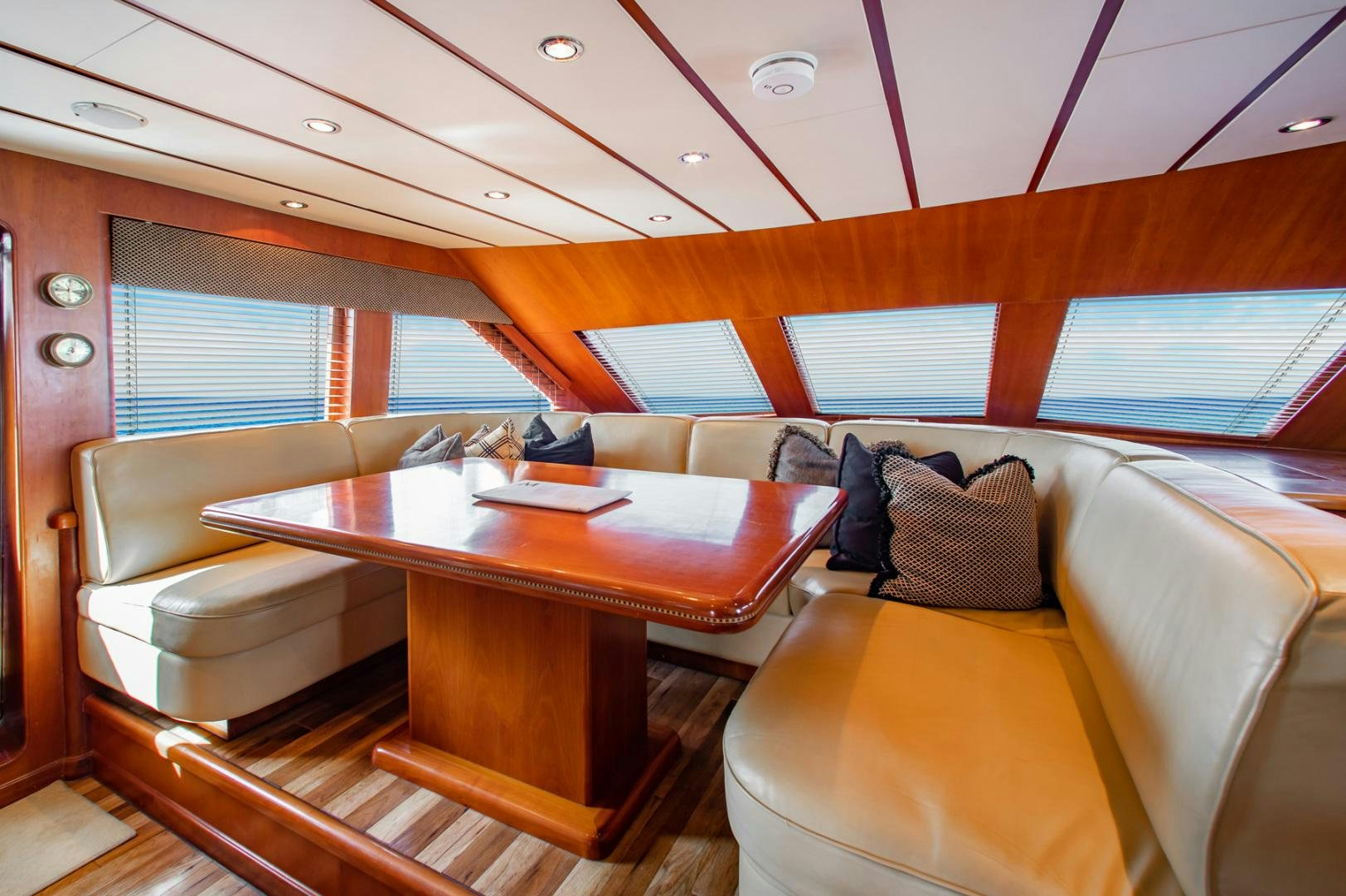 a room with a table and chairs aboard BOXES II Yacht for Sale