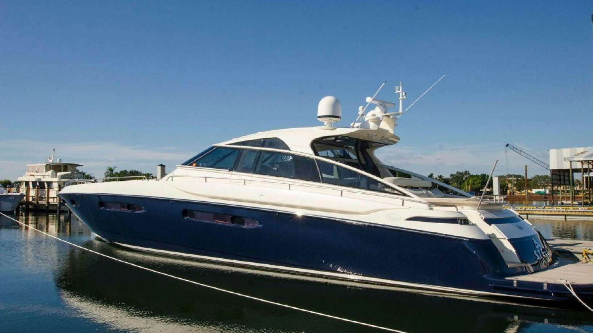 a boat docked at a pier aboard DIVINE MADNESS Yacht for Sale