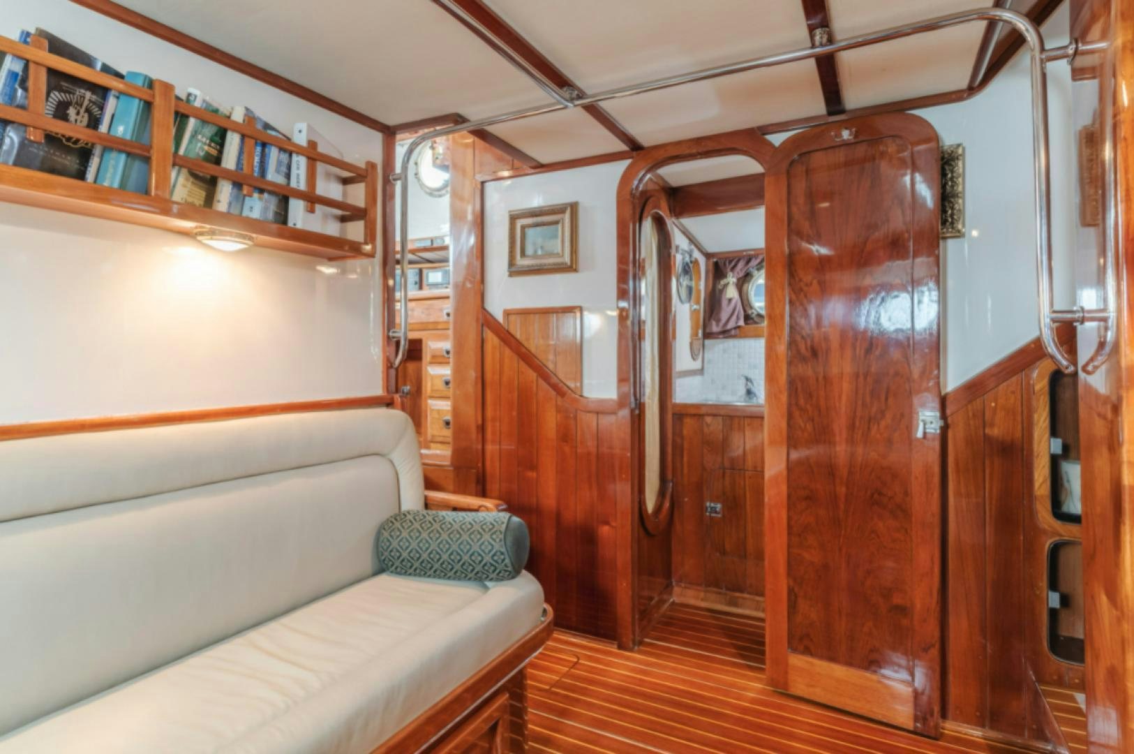 a room with a bed and a couch aboard Iolair Mara Yacht for Sale