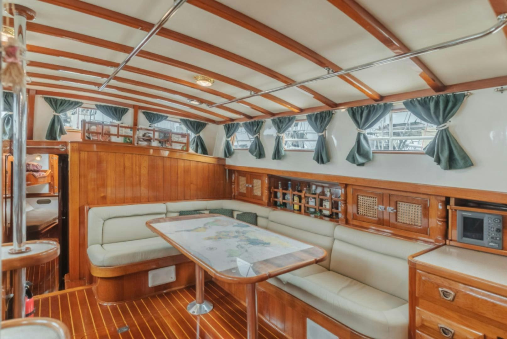 a room with a bed and a table aboard Iolair Mara Yacht for Sale