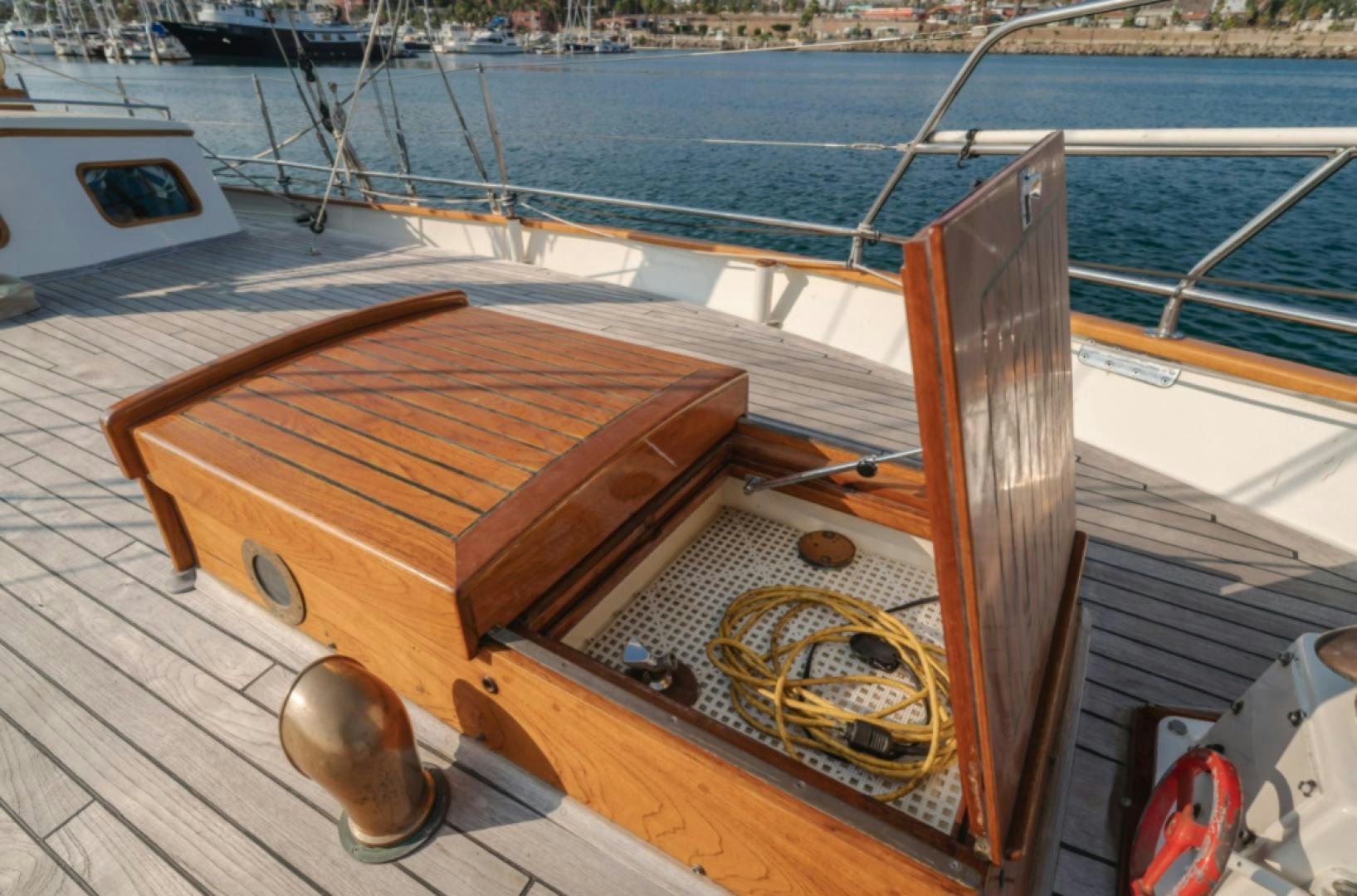 a wooden boat on a deck aboard Iolair Mara Yacht for Sale