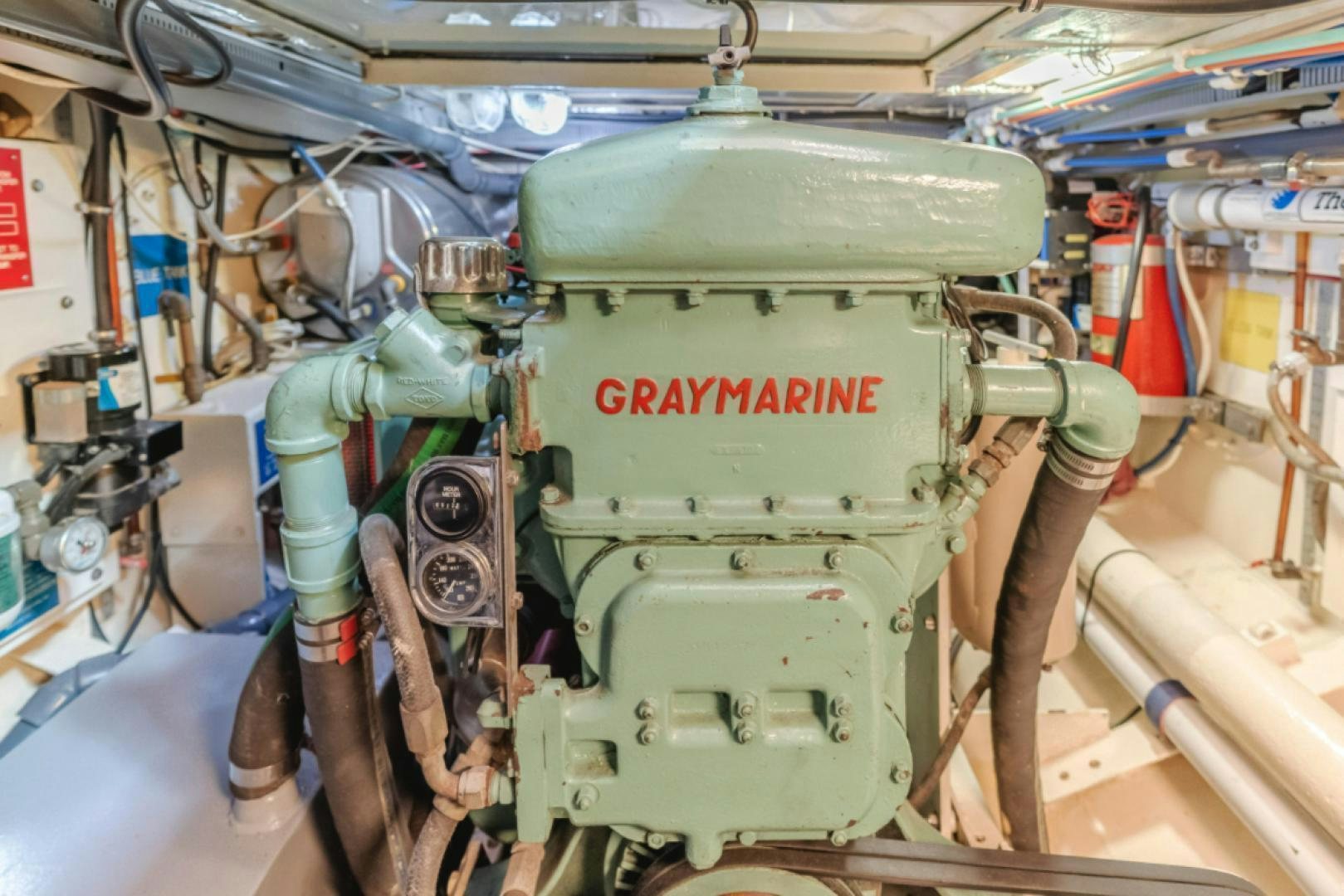 a green machine with a metal cylinder aboard Iolair Mara Yacht for Sale