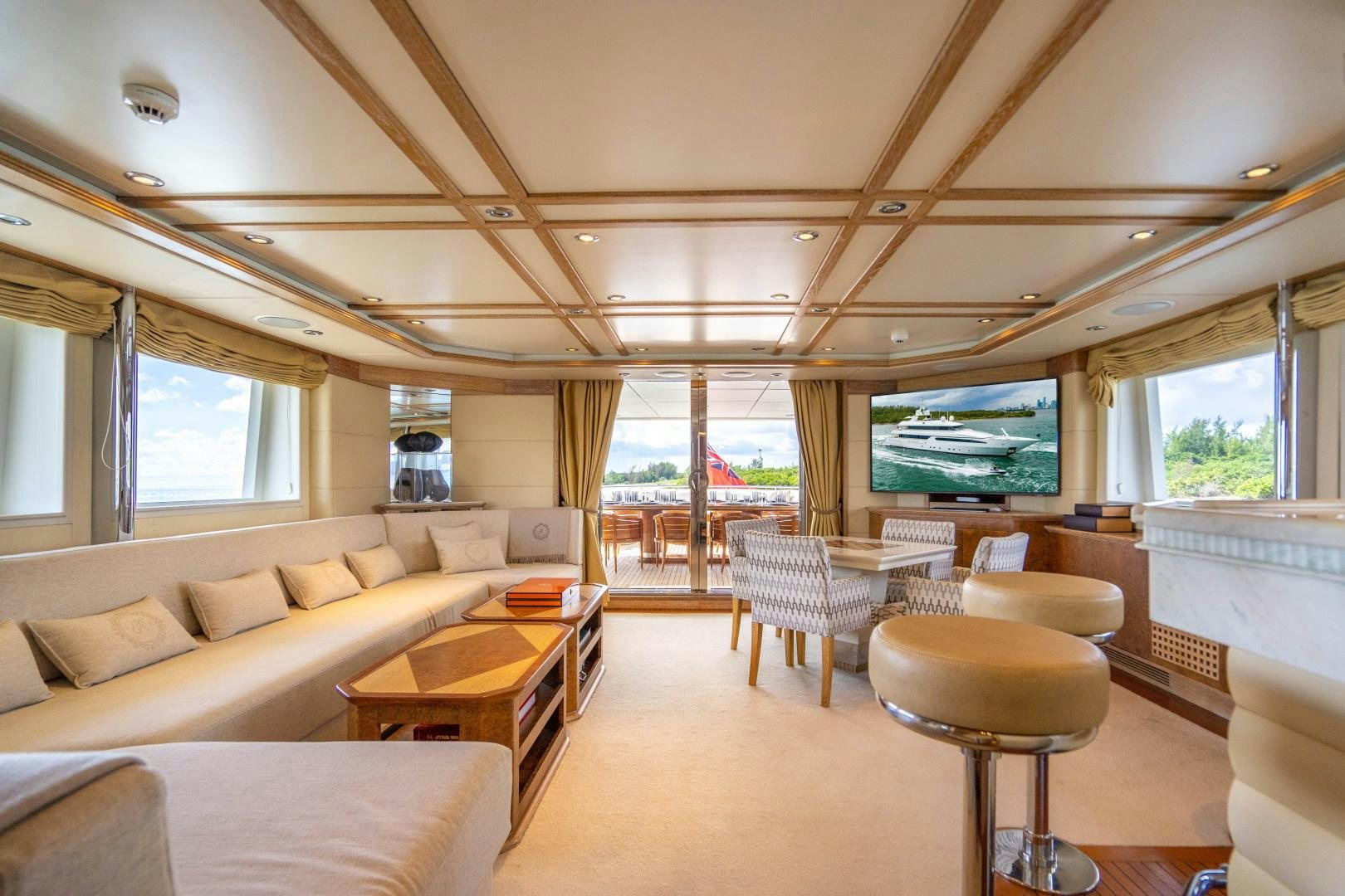 a living room with a large screen aboard ARTEMISEA Yacht for Sale