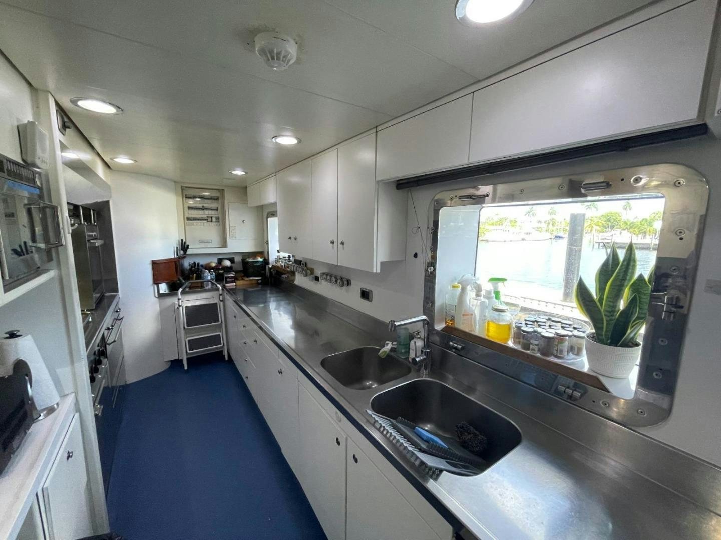 a kitchen with a sink and a window aboard ARTEMISEA Yacht for Sale