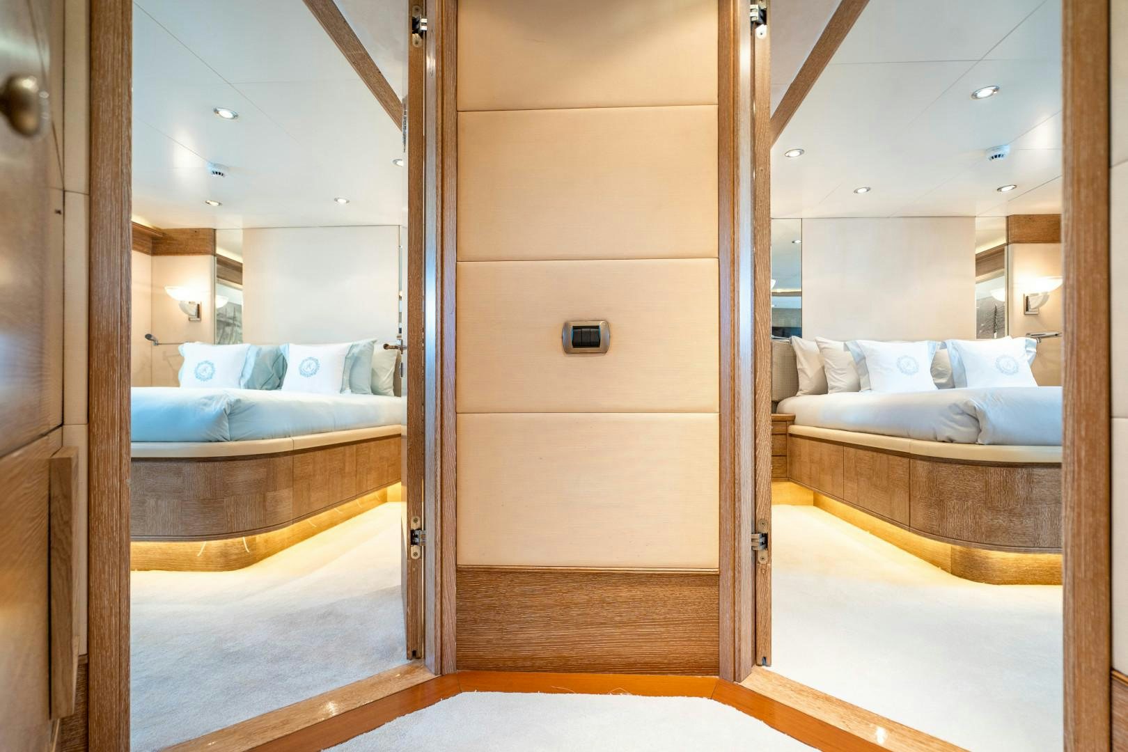 a room with a bed and a mirror aboard ARTEMISEA Yacht for Sale