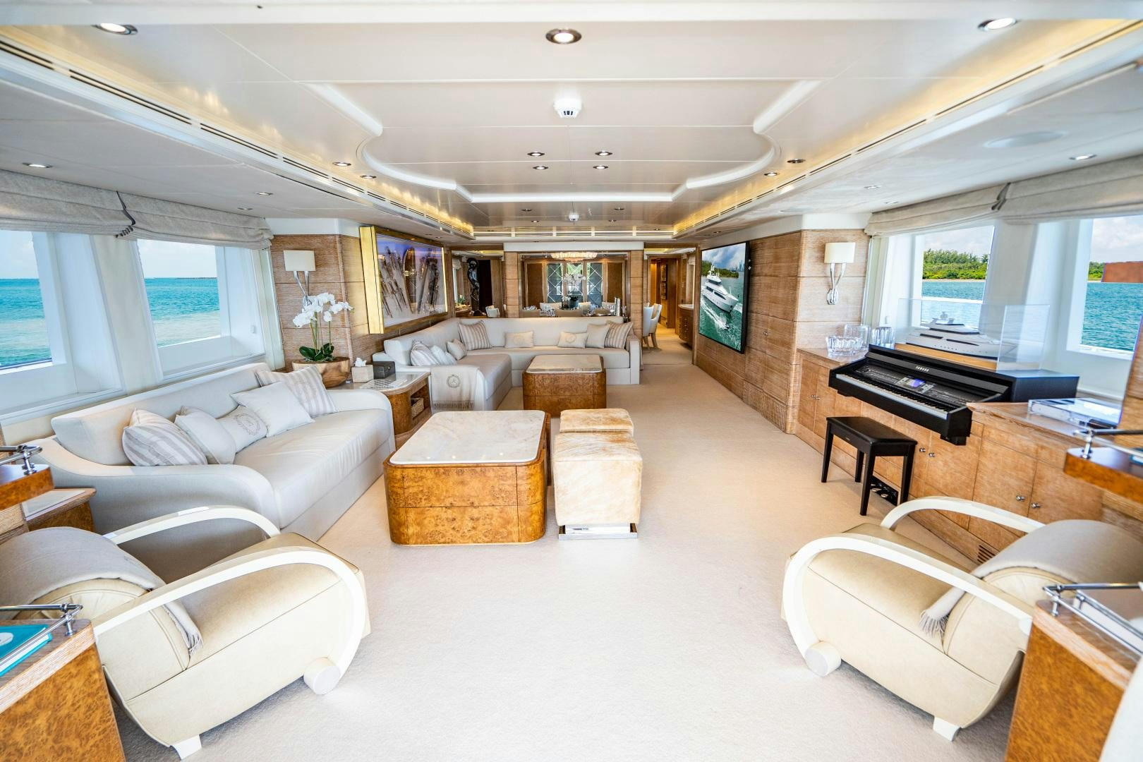 a living room with a piano aboard ARTEMISEA Yacht for Sale