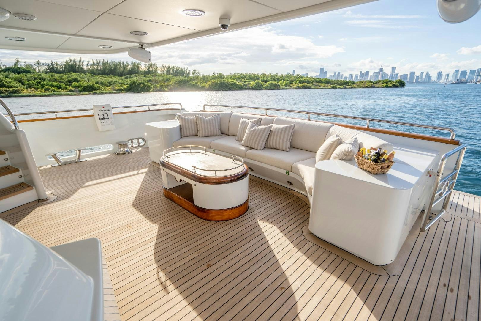 a room with a couch and a table and chairs on a deck aboard ARTEMISEA Yacht for Sale