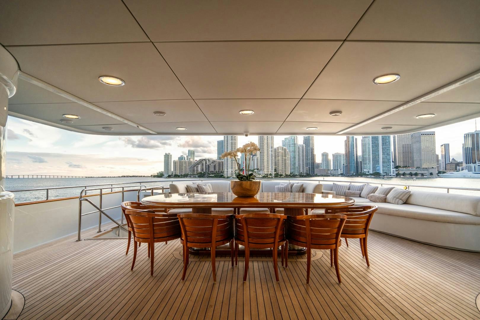 a large room with a table and chairs aboard ARTEMISEA Yacht for Sale