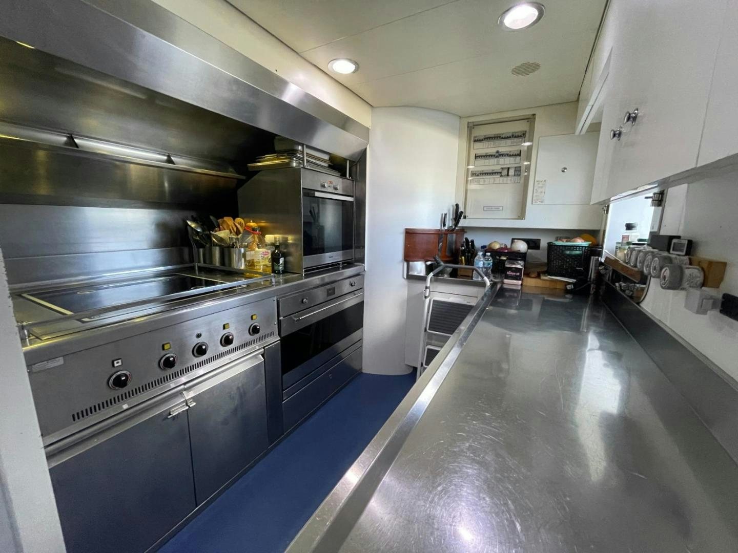 a kitchen with stainless steel appliances aboard ARTEMISEA Yacht for Sale