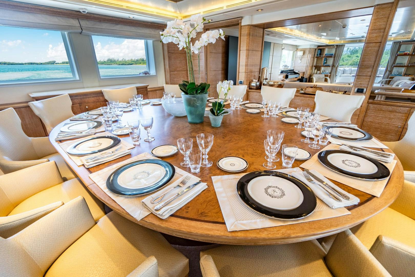 a table with plates and glasses aboard ARTEMISEA Yacht for Sale