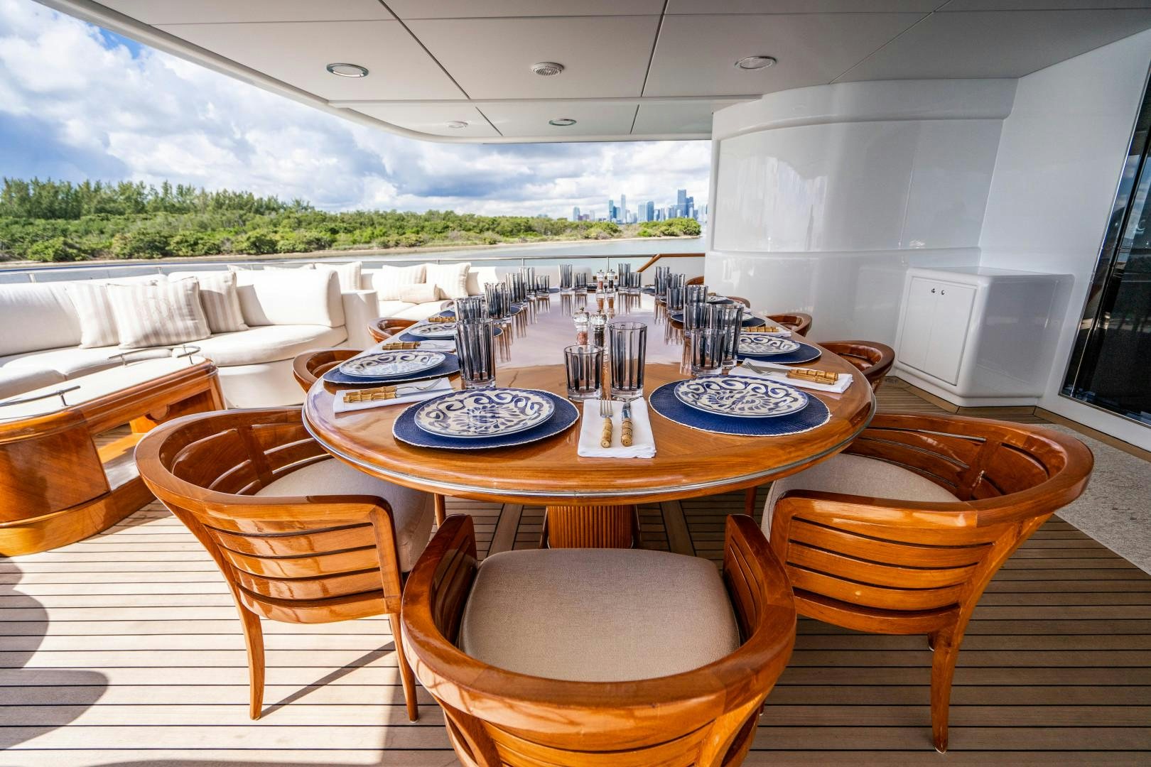 a table with plates and cups on it aboard ARTEMISEA Yacht for Sale