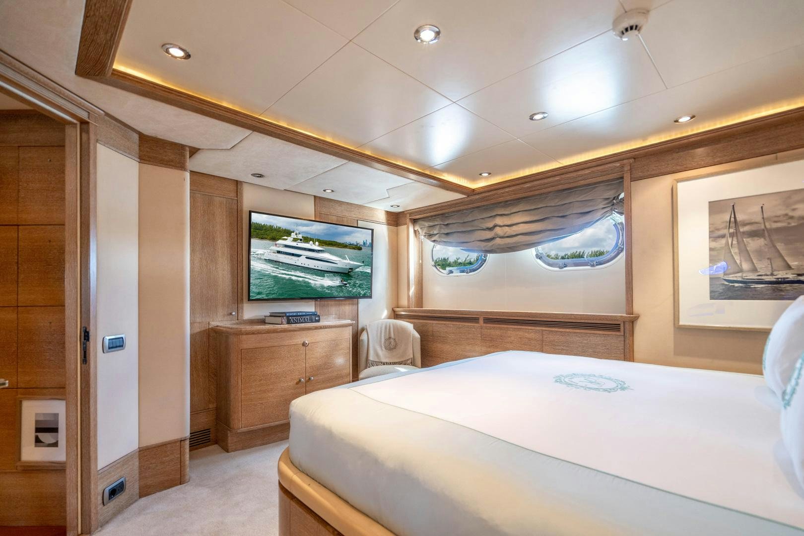 a room with a bed and a television aboard ARTEMISEA Yacht for Sale