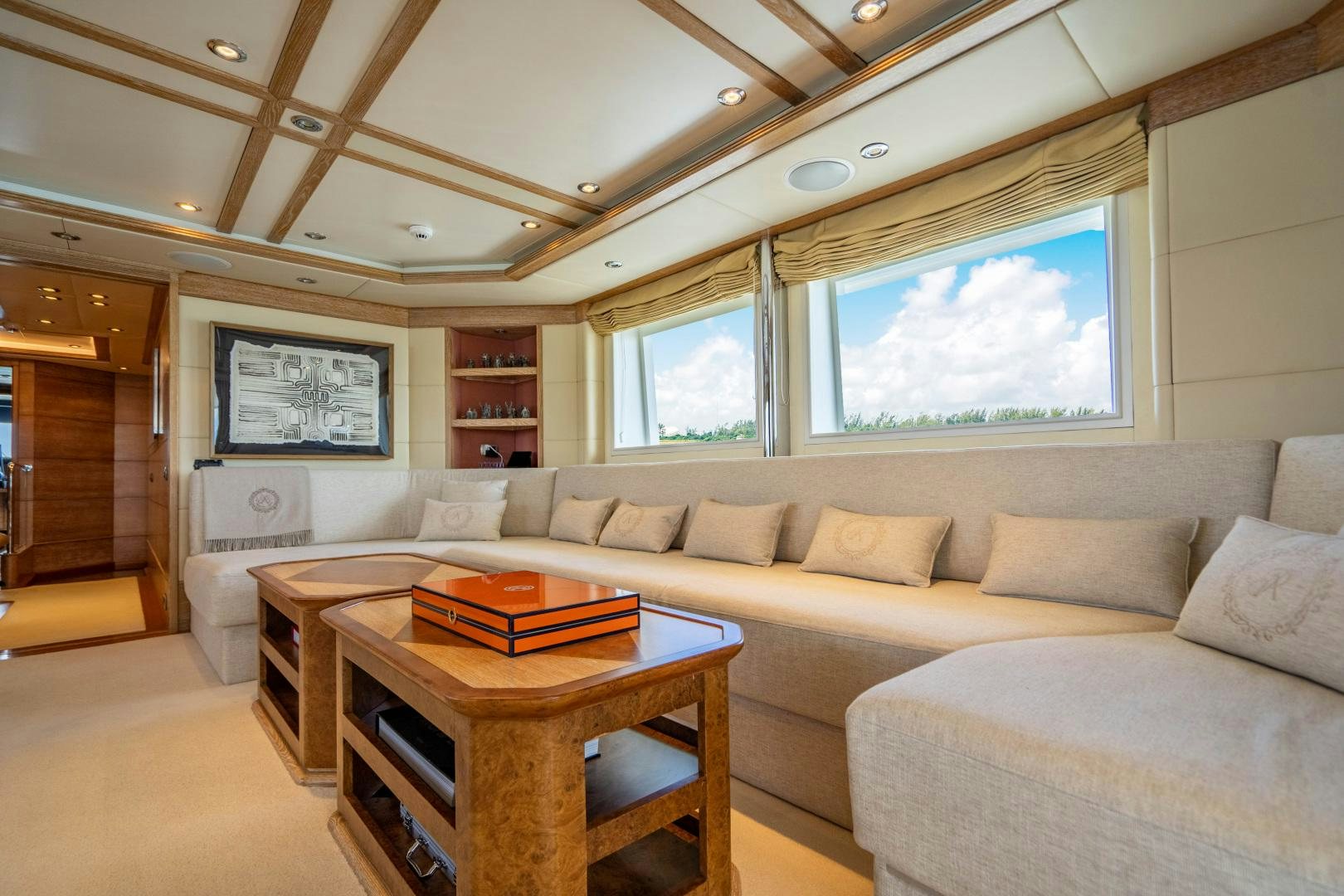 a living room with a couch and a table aboard ARTEMISEA Yacht for Sale