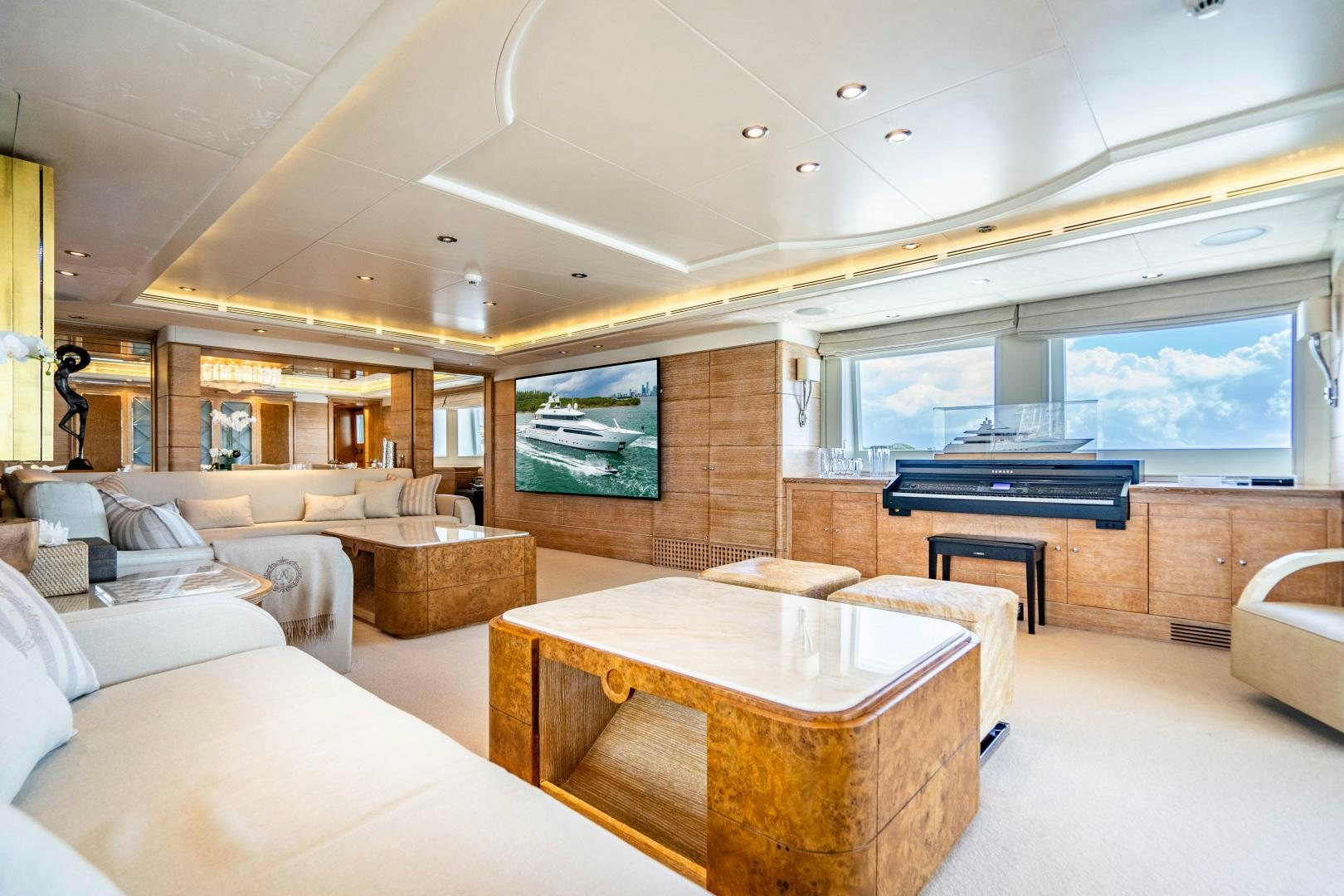 a room with a table and couches aboard ARTEMISEA Yacht for Sale