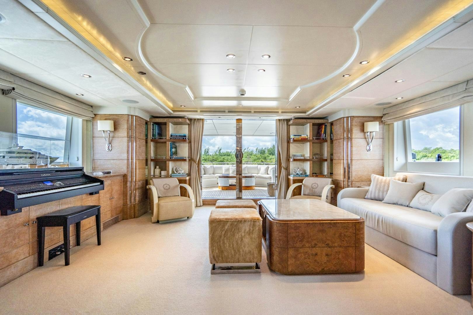 a living room with a fireplace aboard ARTEMISEA Yacht for Sale