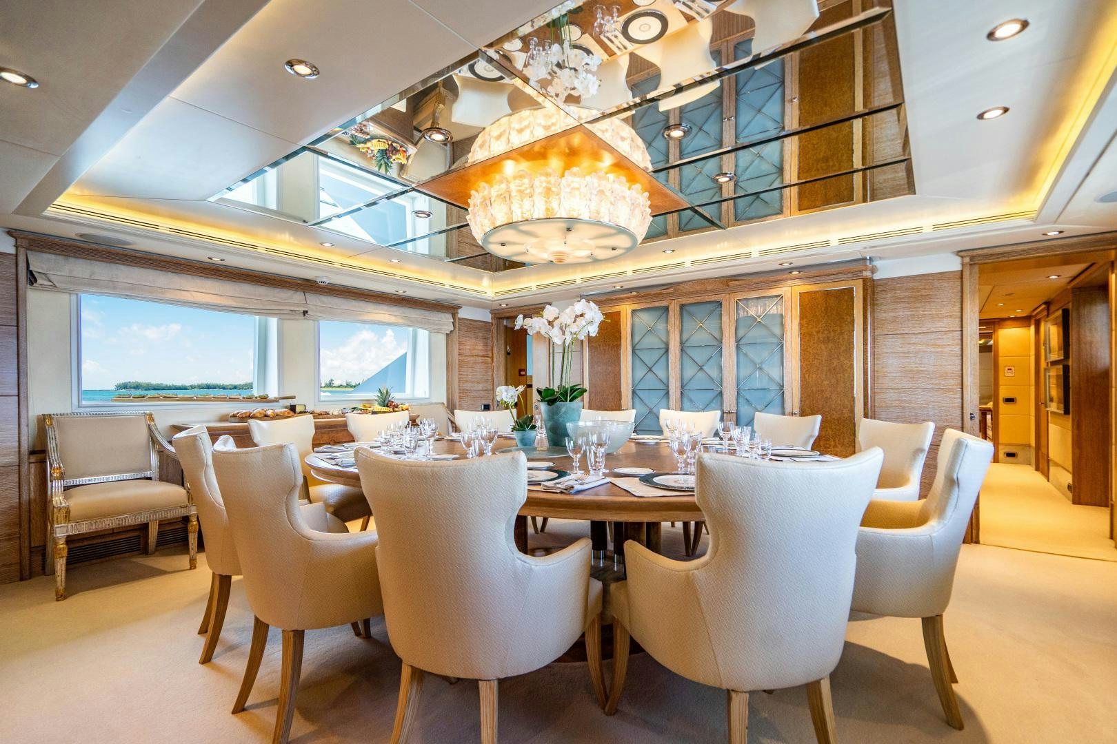 a room with tables and chairs aboard ARTEMISEA Yacht for Sale