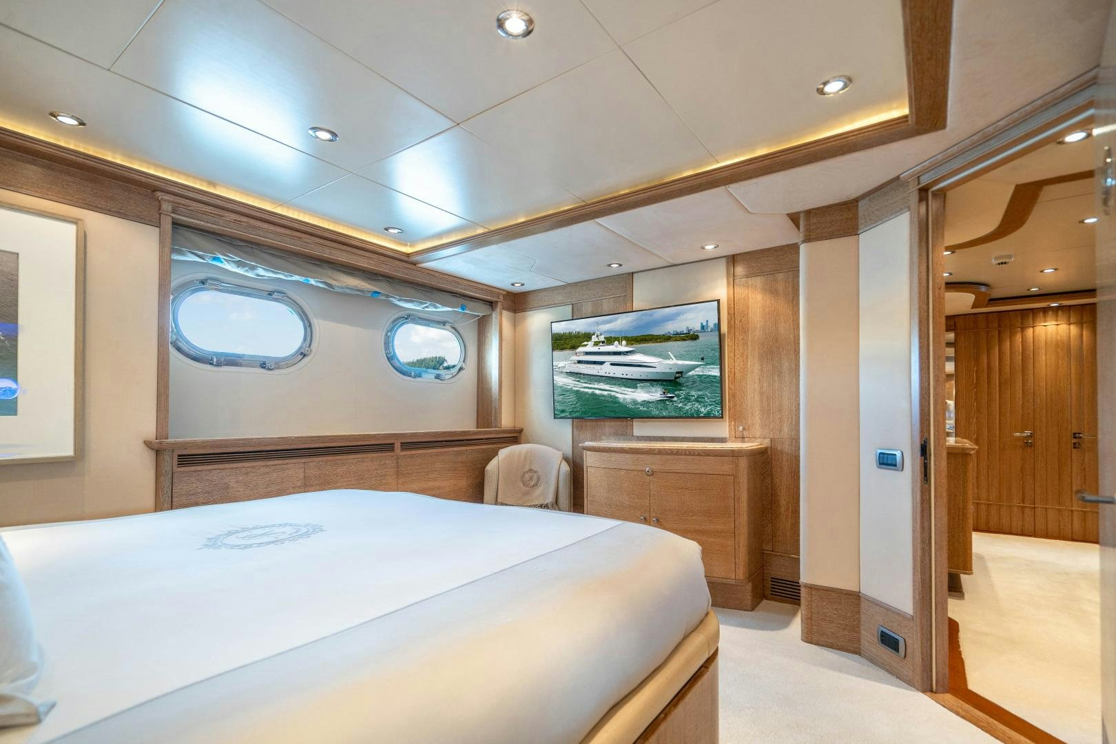 a room with a bed and a mirror aboard ARTEMISEA Yacht for Sale