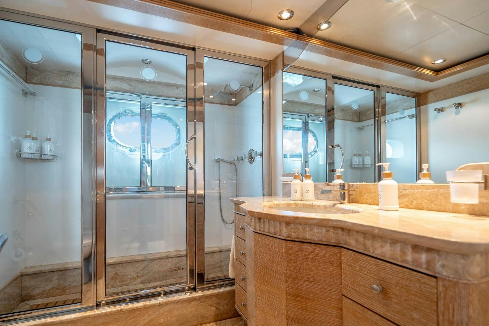 a bathroom with a large glass shower aboard ARTEMISEA Yacht for Sale