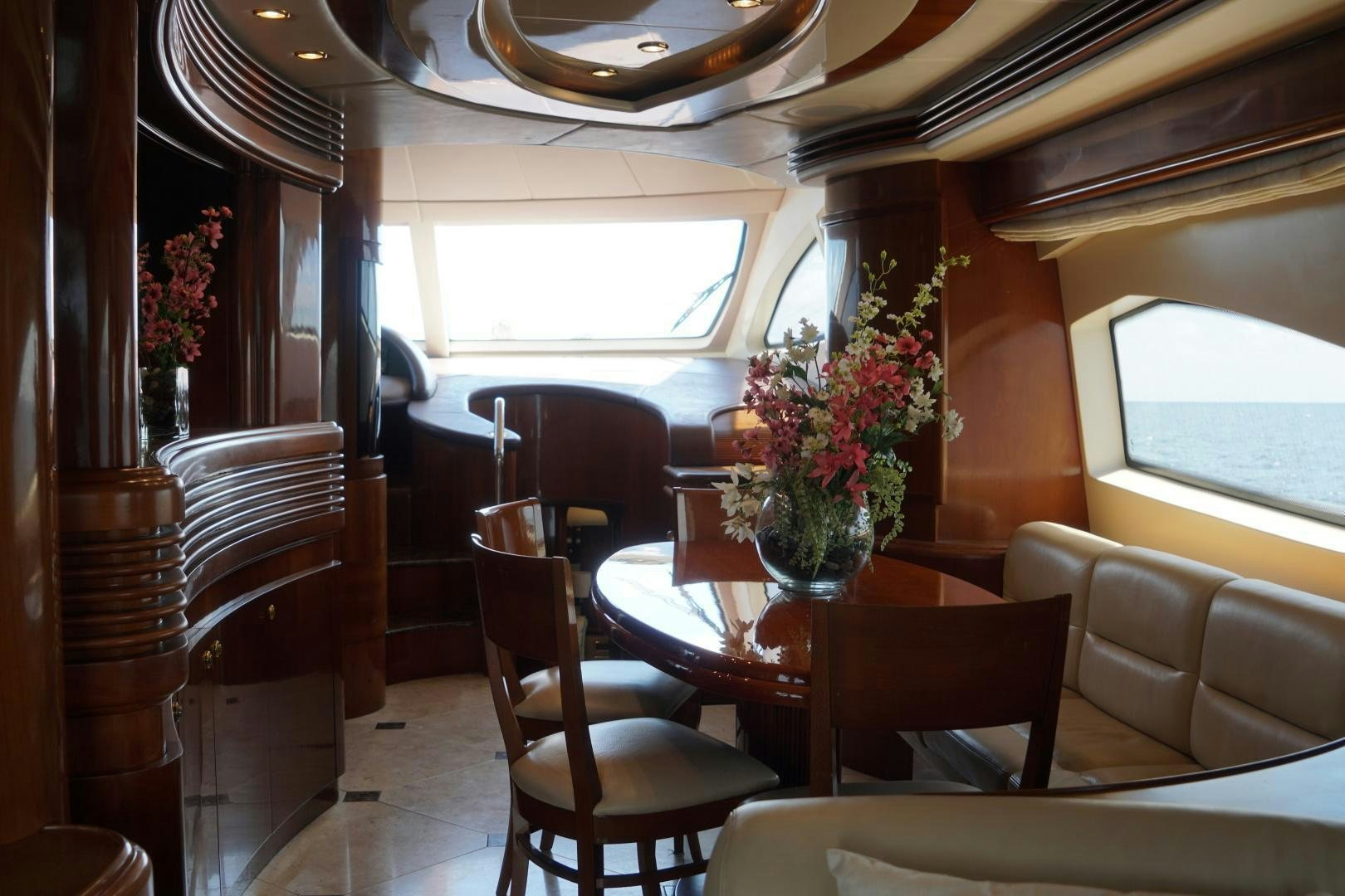 a train with a table and chairs aboard AZURE Yacht for Sale