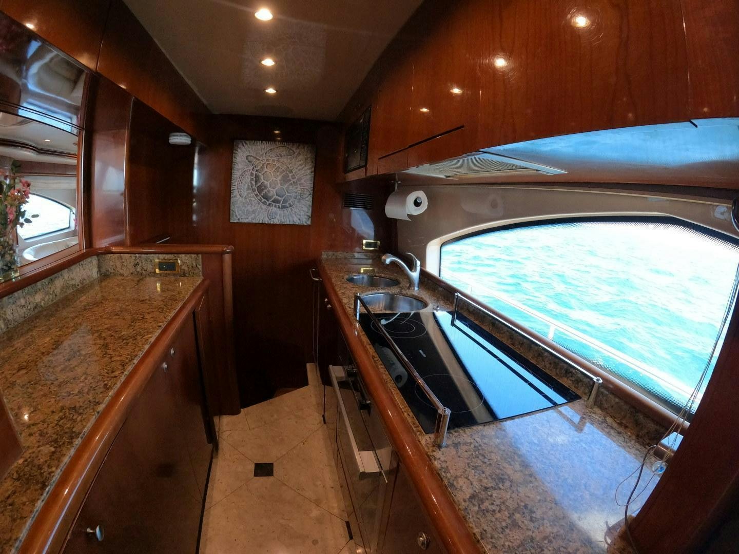 a kitchen with a large window aboard AZURE Yacht for Sale