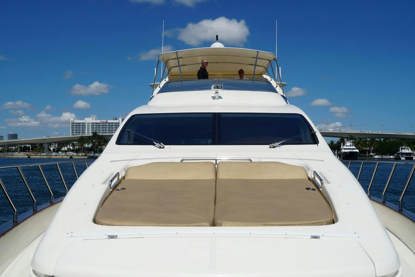 a white yacht on a dock aboard AZURE Yacht for Sale