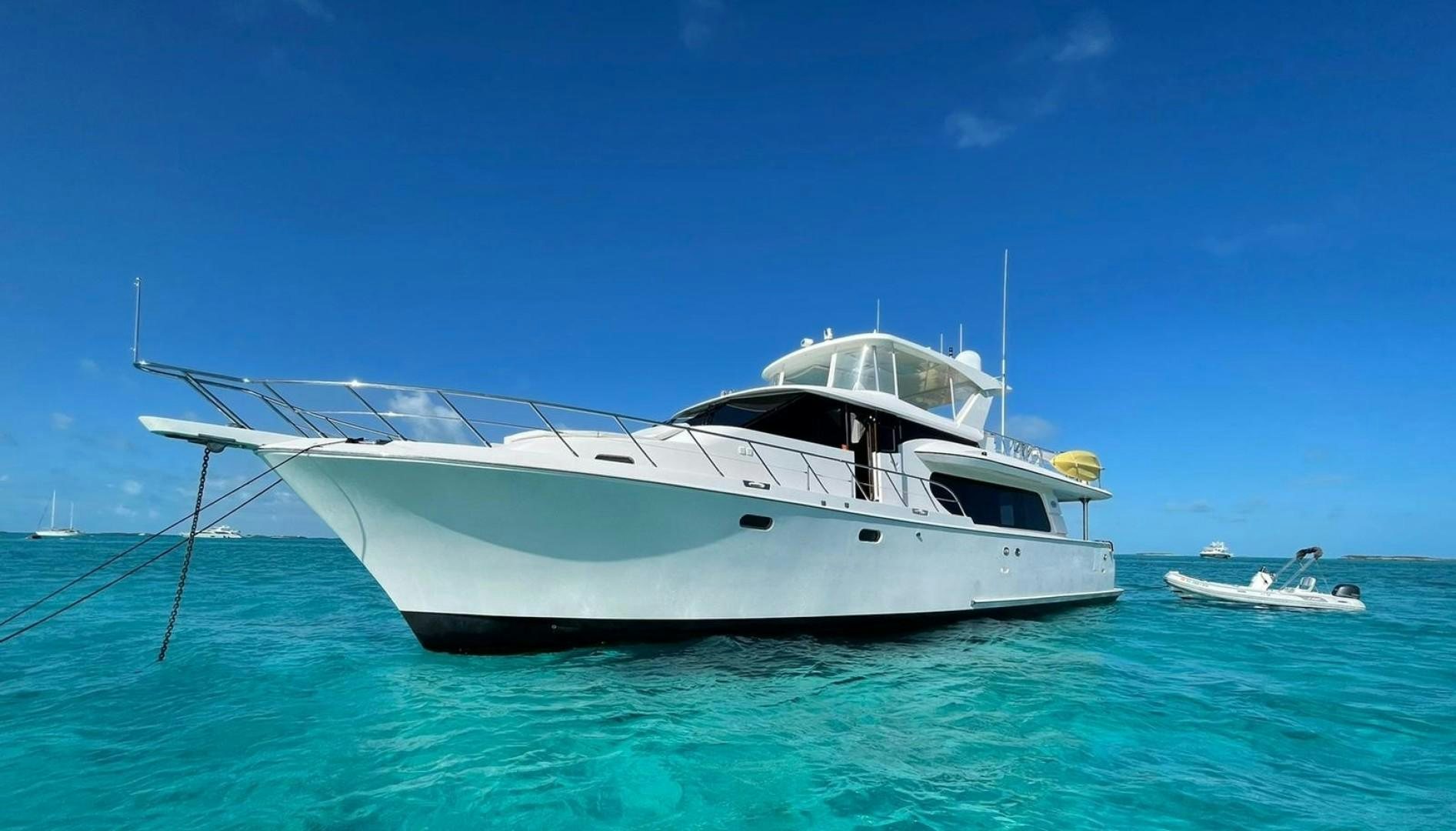 a white boat in the water aboard TJ SQUARED Yacht for Sale