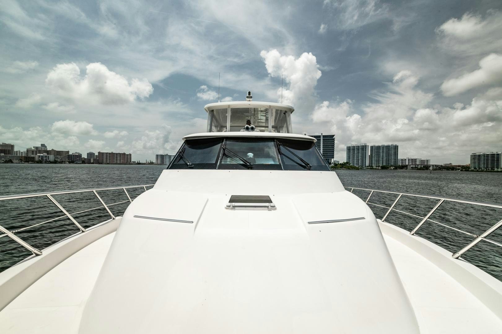 a white car on a road aboard TJ SQUARED Yacht for Sale