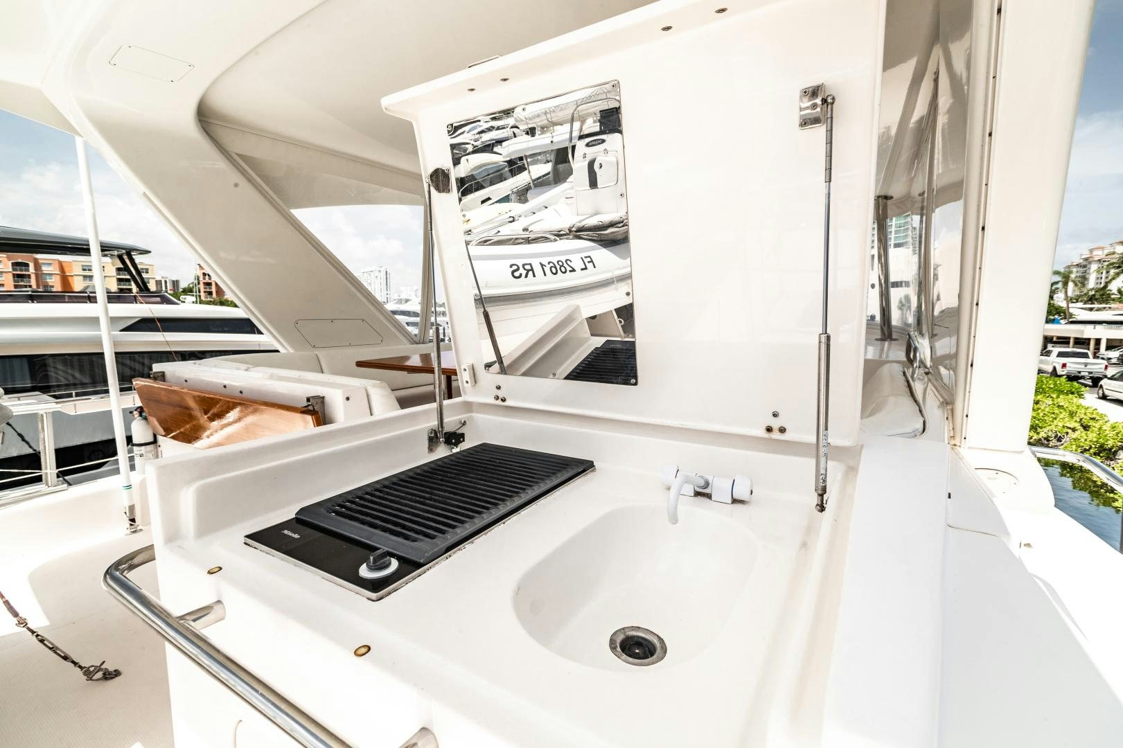 a white sink with a black faucet aboard TJ SQUARED Yacht for Sale