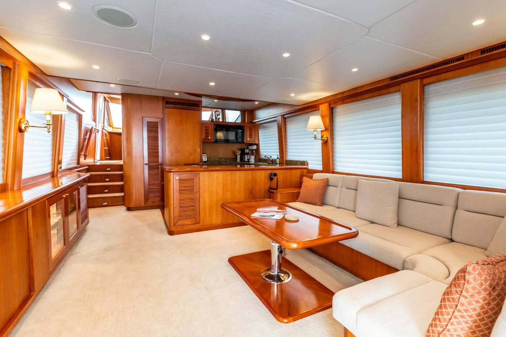 a living room with a couch and a table aboard TJ SQUARED Yacht for Sale