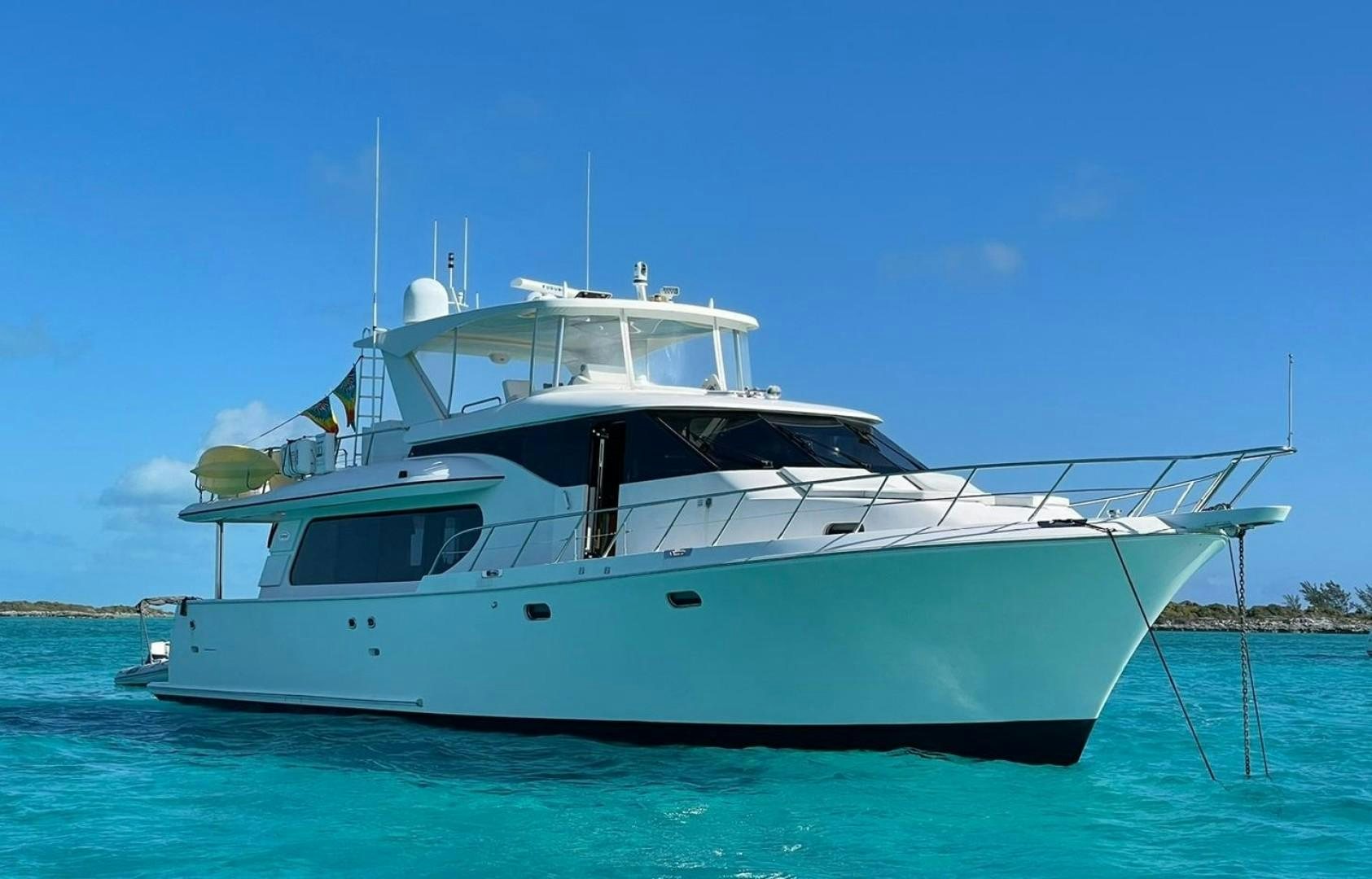a white boat in the water aboard TJ SQUARED Yacht for Sale