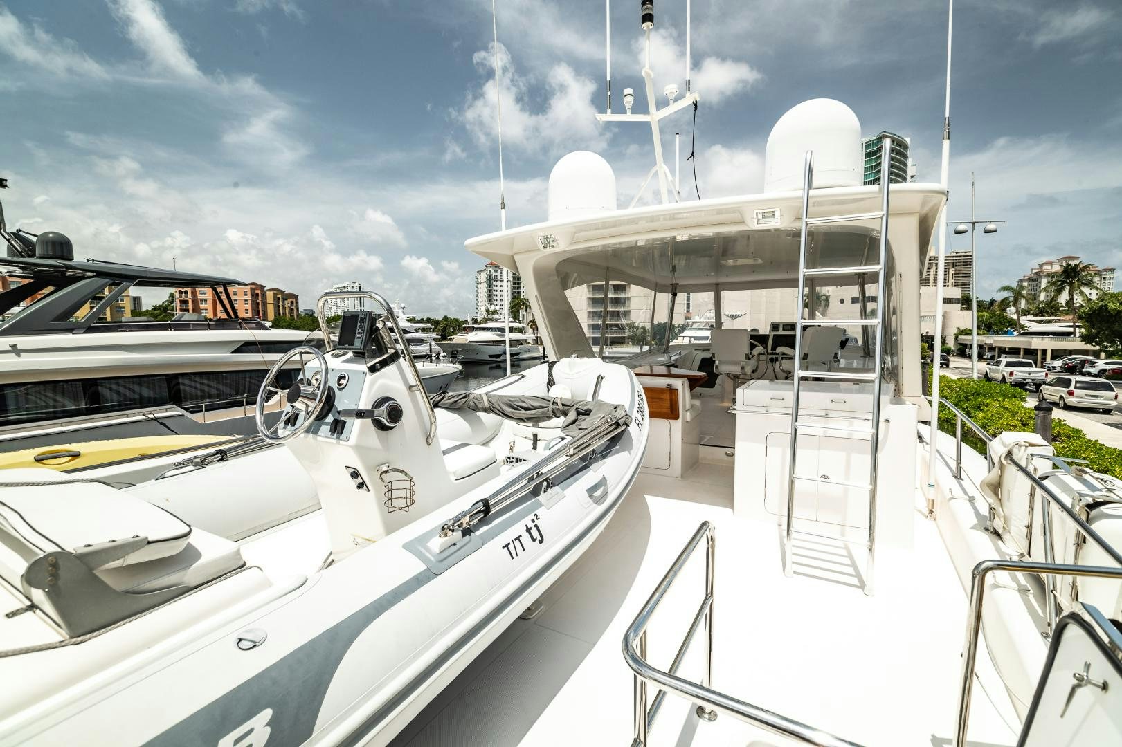 a boat docked at a pier aboard TJ SQUARED Yacht for Sale