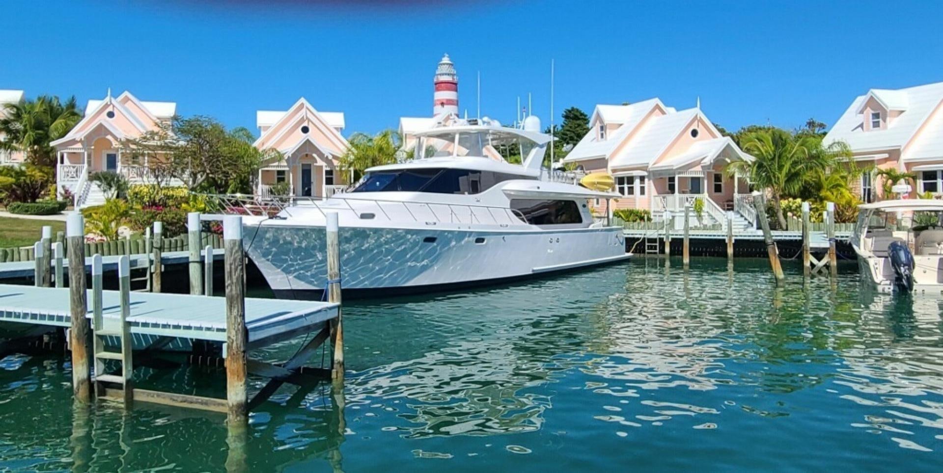 a boat docked at a pier aboard TJ SQUARED Yacht for Sale