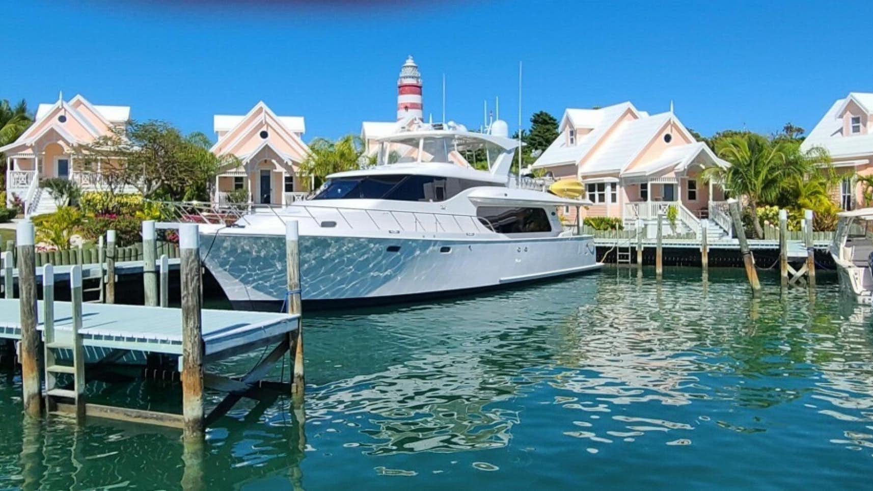 a boat docked at a pier aboard TJ SQUARED Yacht for Sale