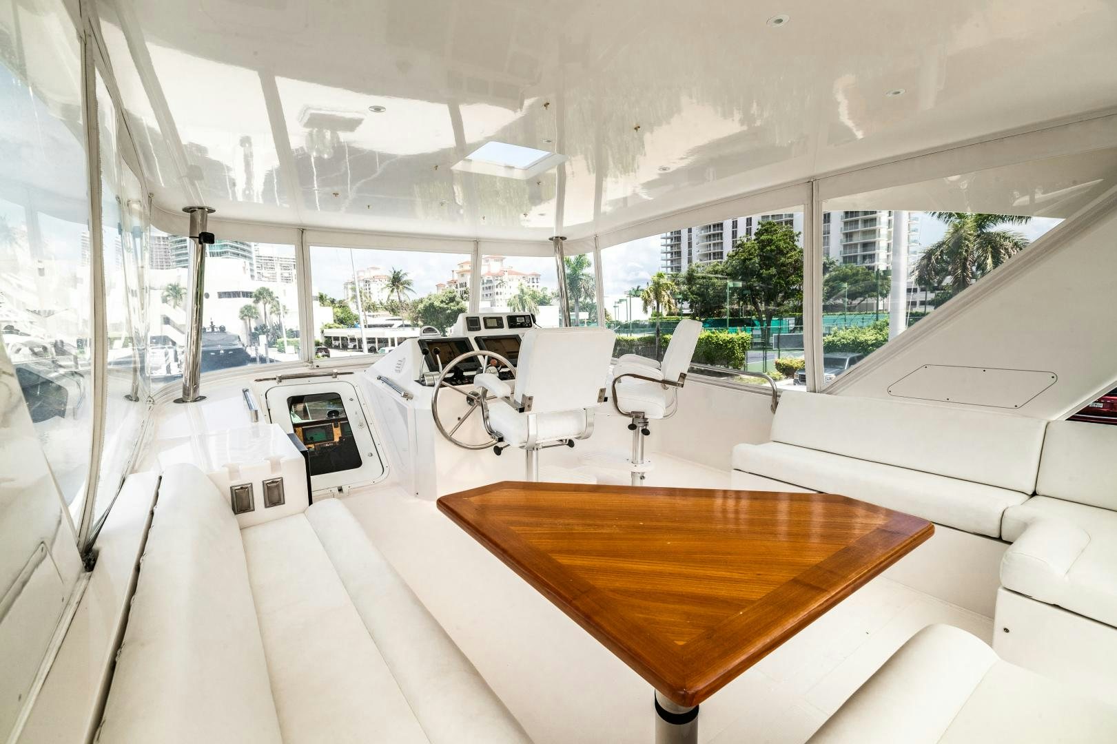 a room with a table and chairs aboard TJ SQUARED Yacht for Sale