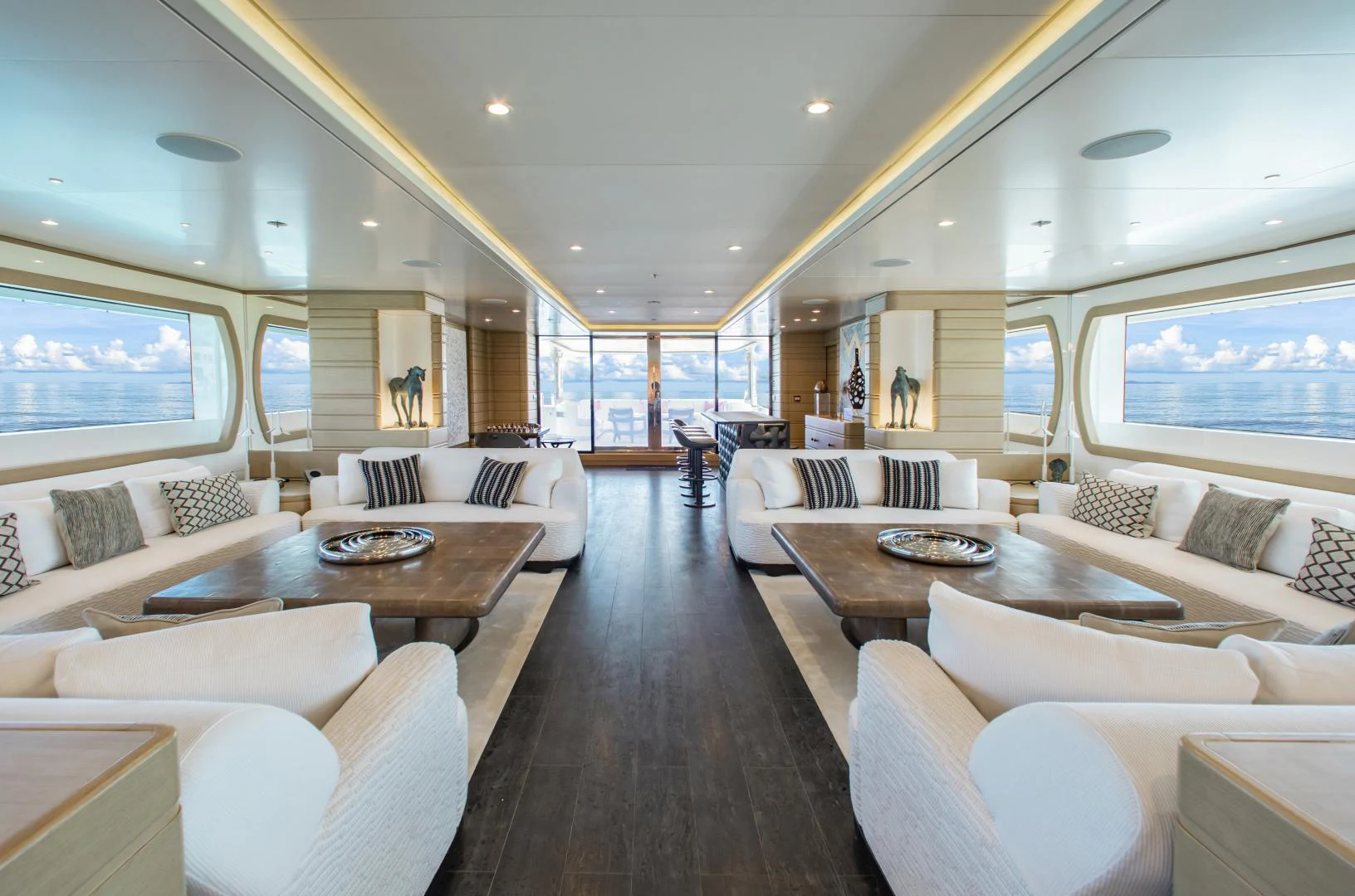 a living room with a large window aboard MOCA Yacht for Charter