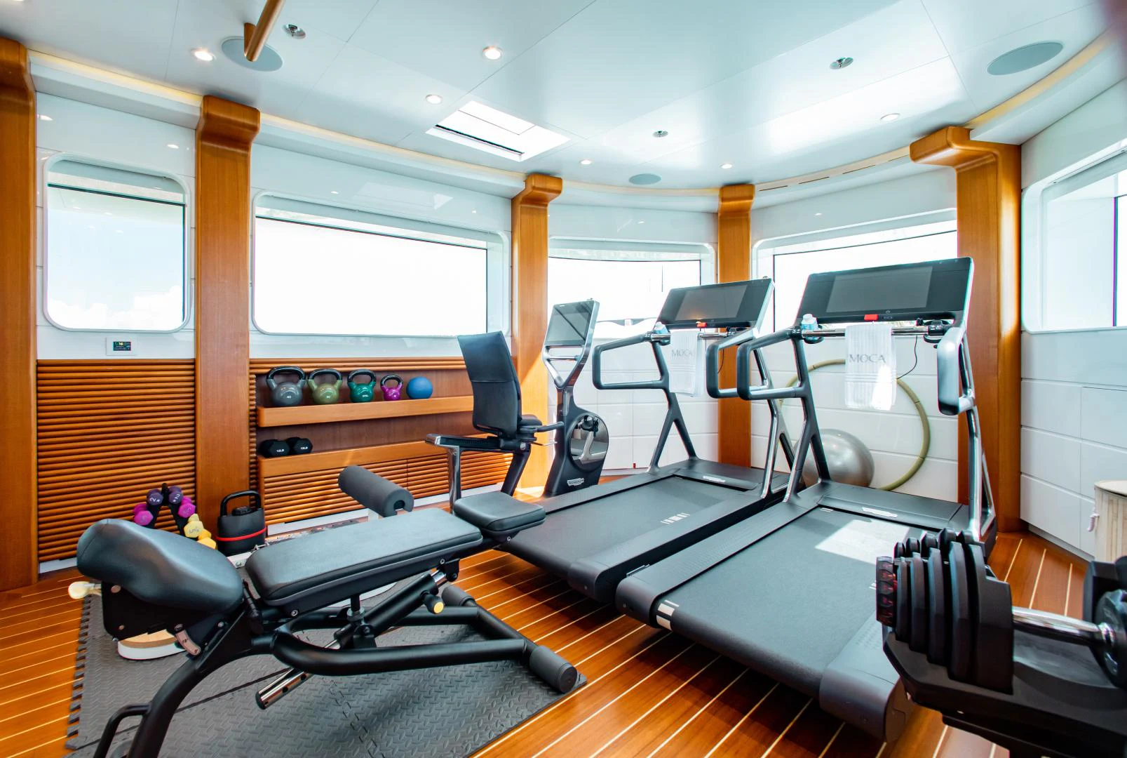 gym with exercise equipment aboard MOCA Yacht for Charter