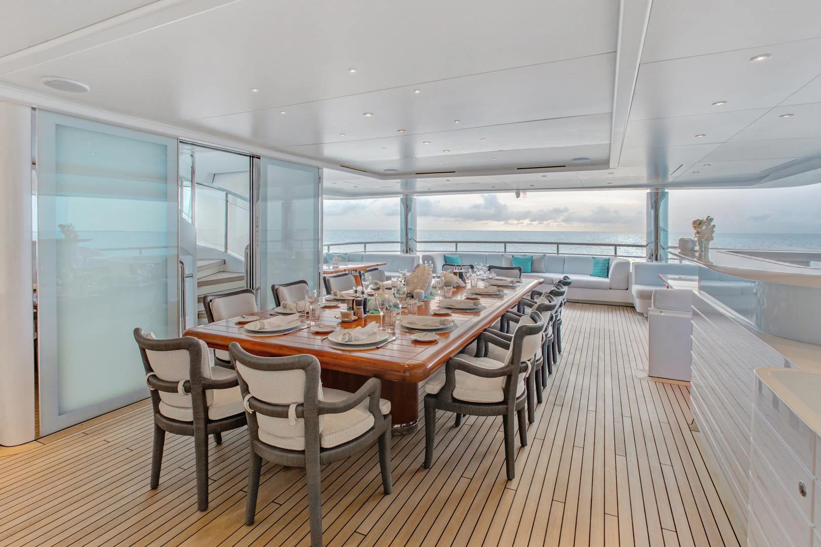a dining room with a large table aboard MOCA Yacht for Charter