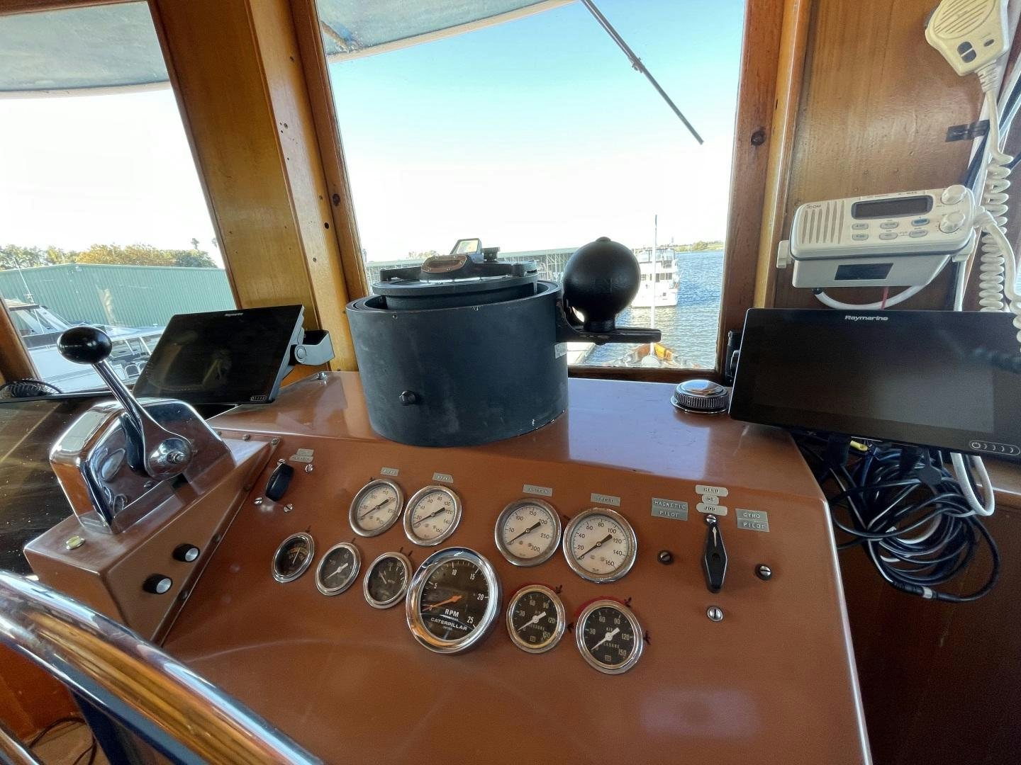 a wooden table with a record player and record player aboard SACAJAWEA Yacht for Sale