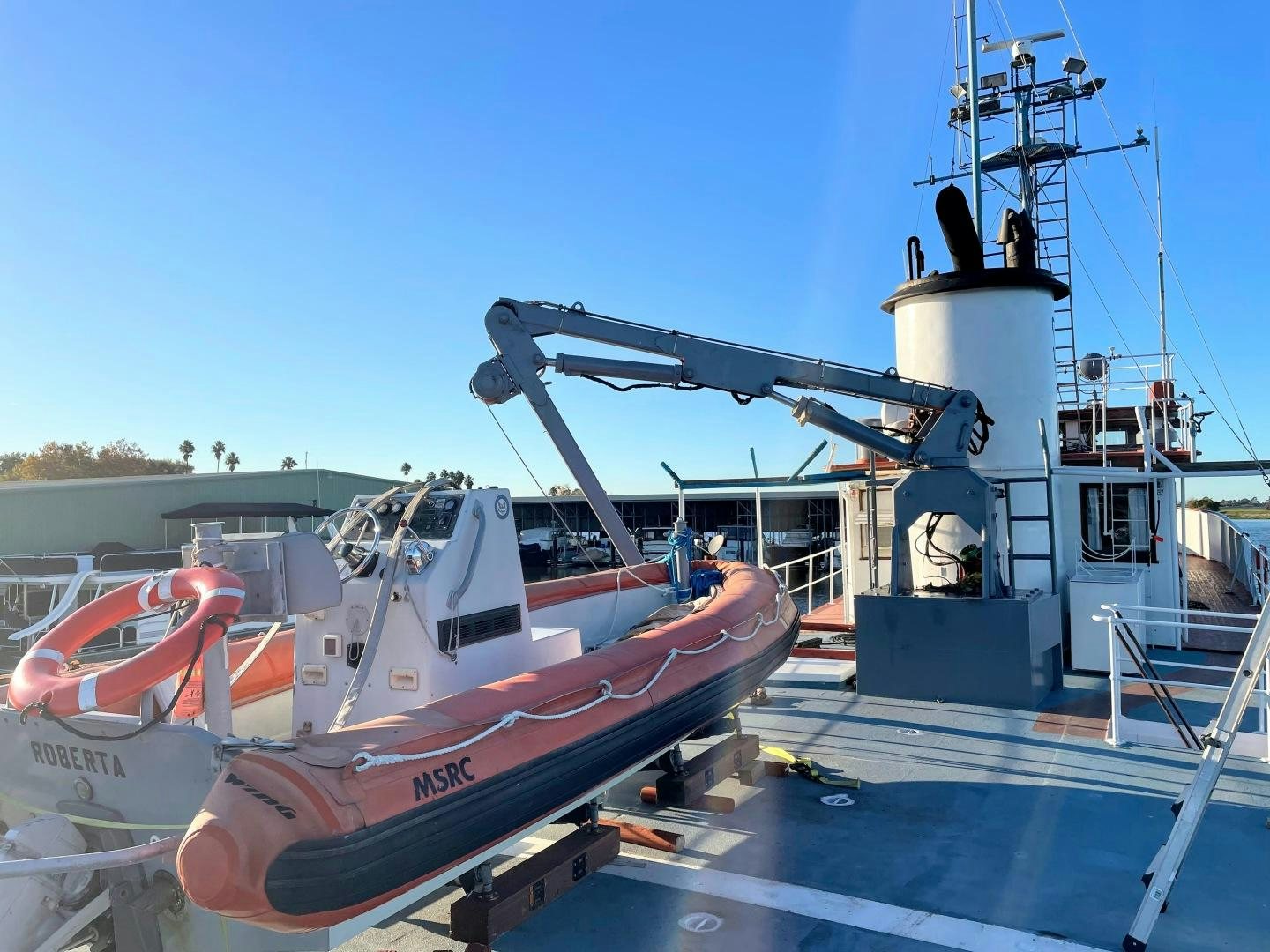 a boat docked at a dock aboard SACAJAWEA Yacht for Sale