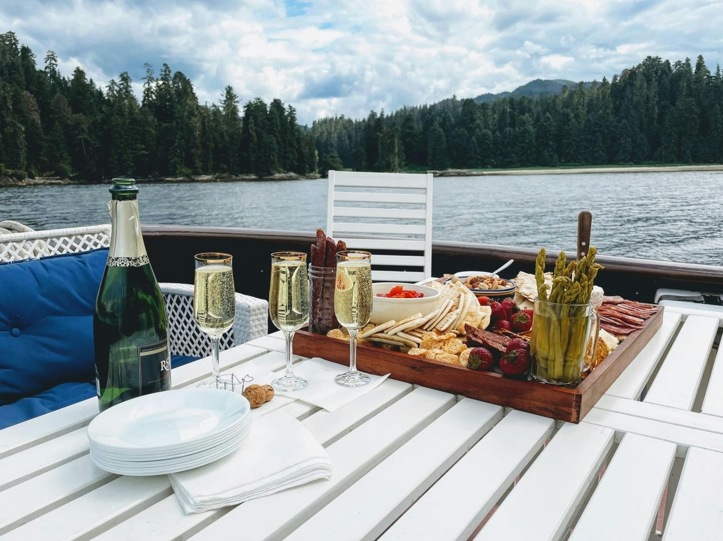 a table with food and drinks on it aboard SACAJAWEA Yacht for Sale